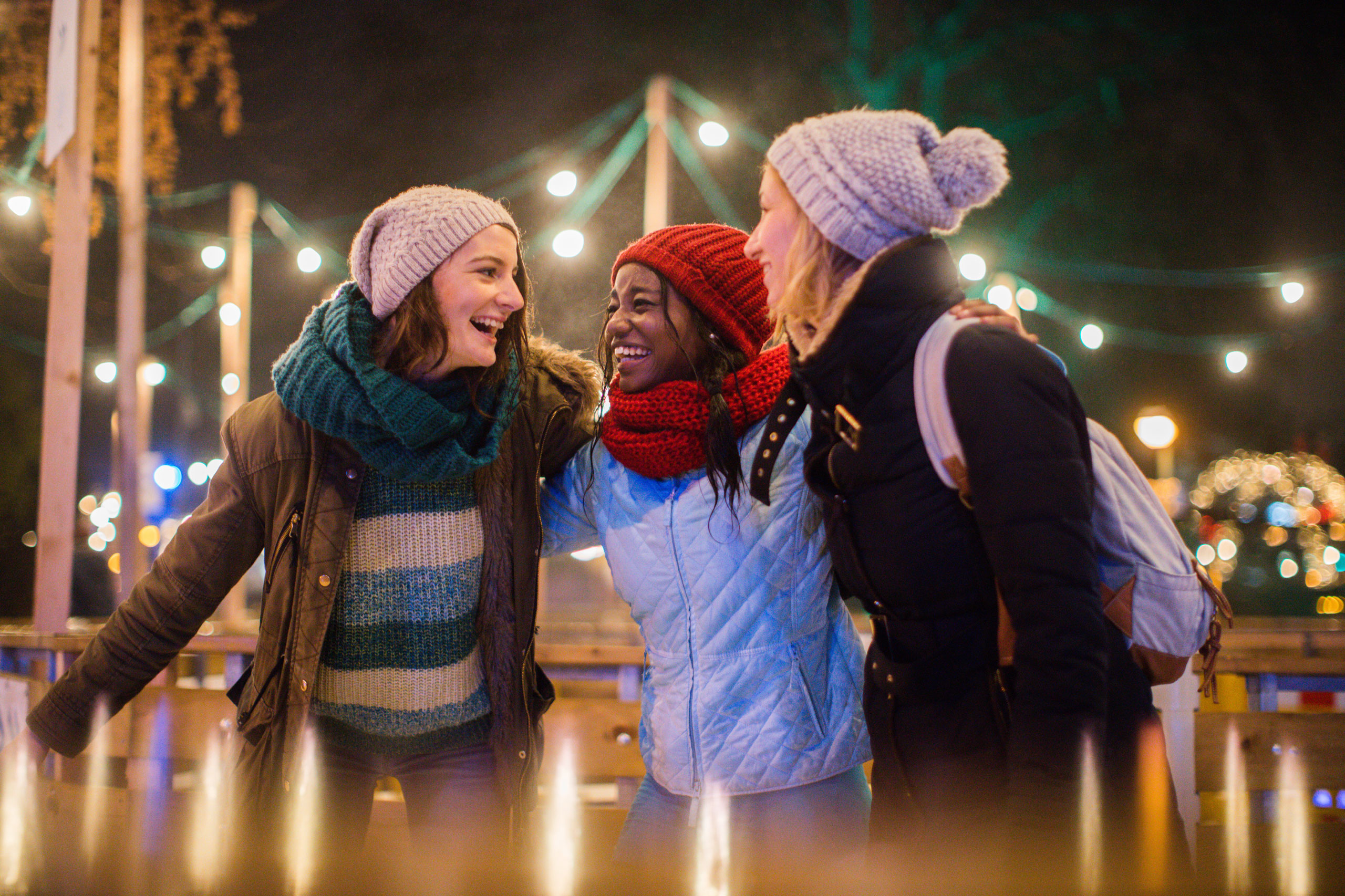 Three girlfriends skating